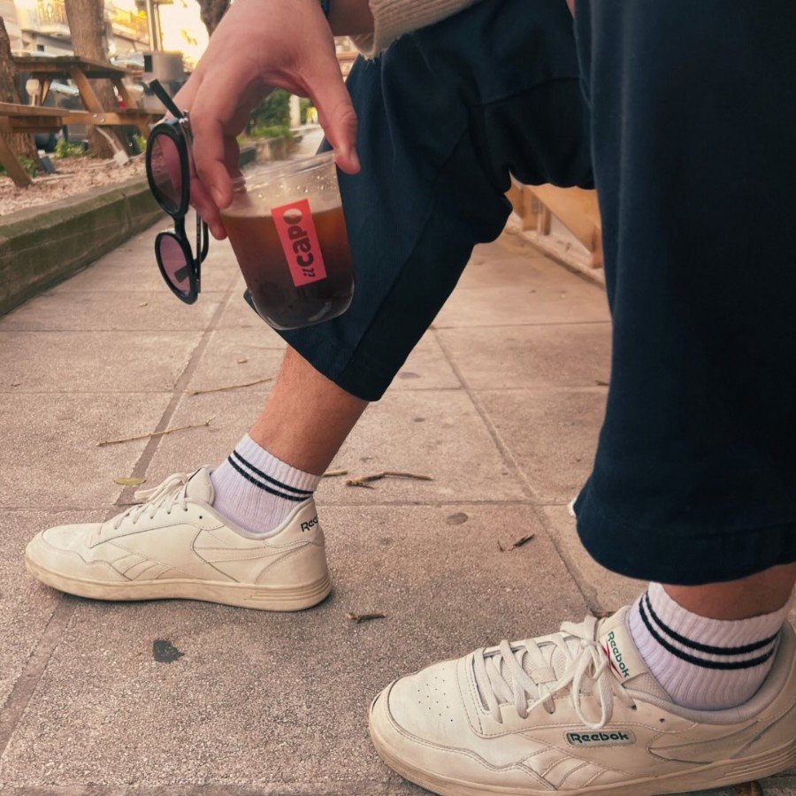 Walking with an IL CAPO iced coffee
