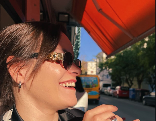 Customer laughing under the shop awning